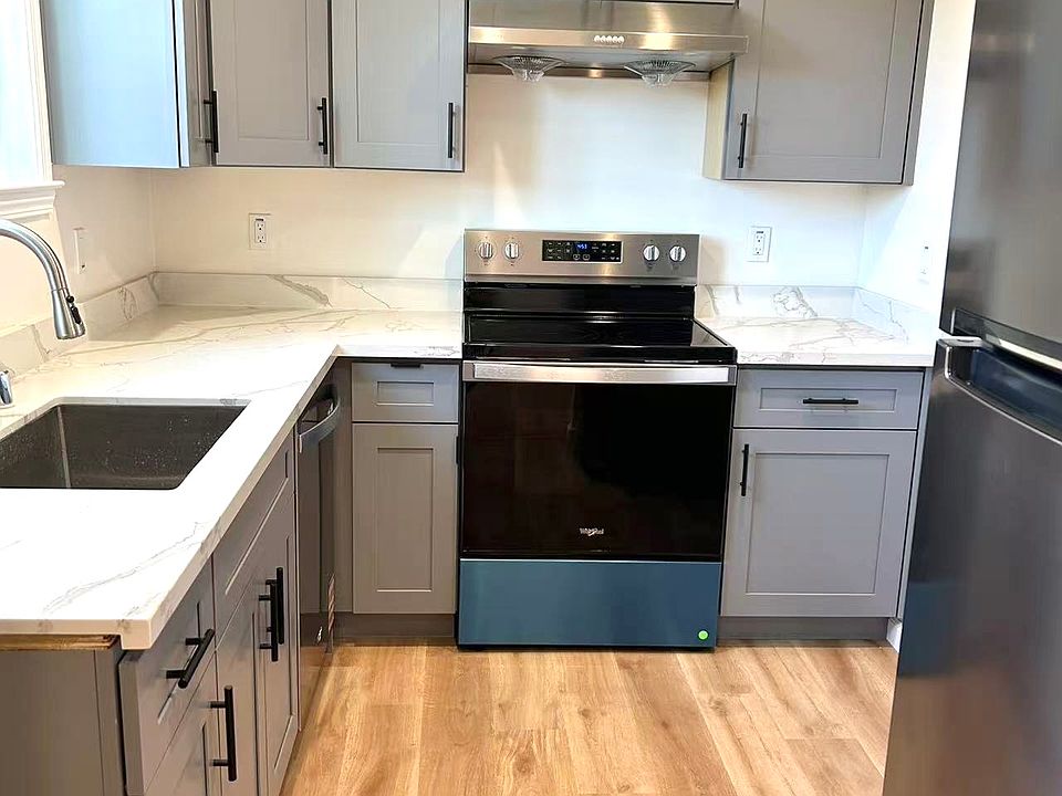 BRAND-NEW kitchen with NEW quartz countertops, NEW shaker cabinets, NEW Whirlpool stainless-steel appliances.