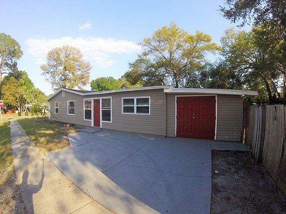 side of home & storage shed