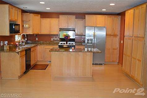 Custom built Maple cabinets and granite counter top.
