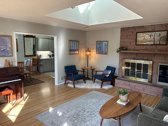 Front Door Entry - Living Room 1 with Skylight, bay window and fireplace 1