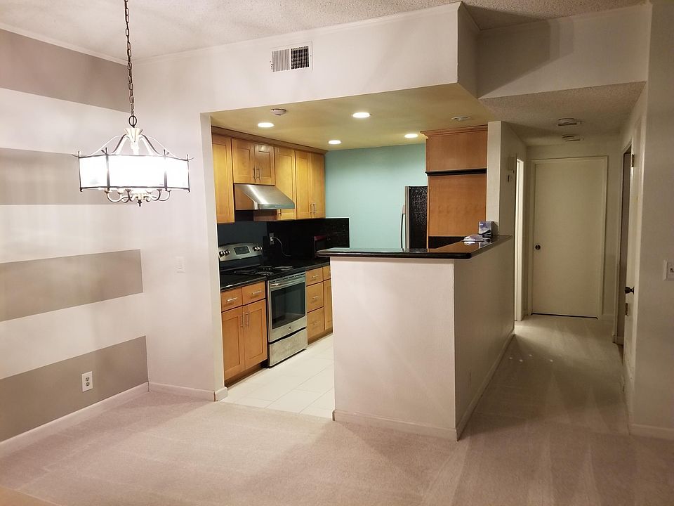 Open kitchen with dimmable lighting. Dining space is part of the living room space.