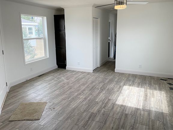 Open Living Room offers Built-In Storage Cabinet
