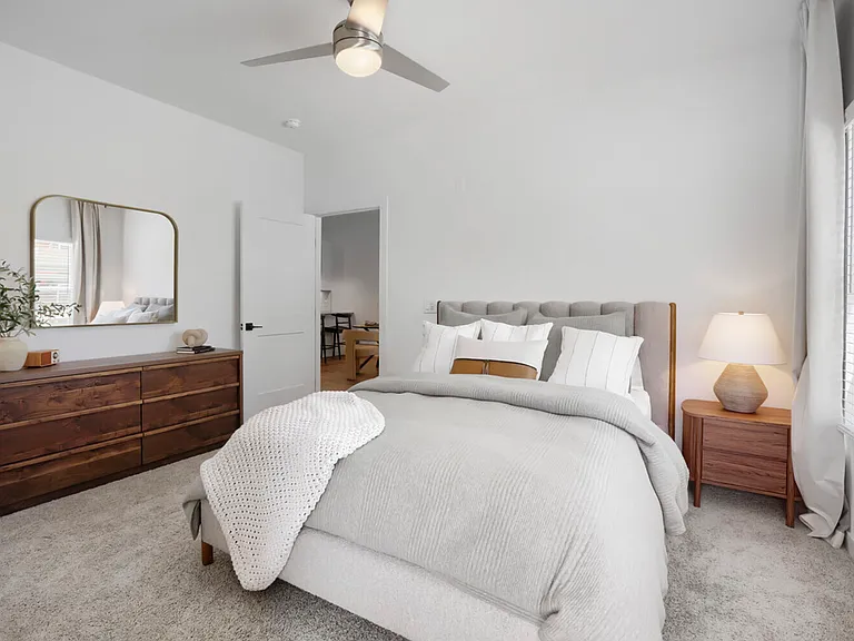 Room to breathe. The B2 primary bedroom's vaulted ceiling and oversized windows create an airy, hotel-like feel that's all yours to enjoy every single night.
