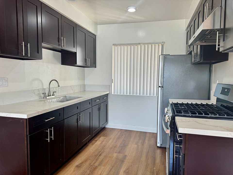 Completely remodeled kitchen with new cabinets, new flooring, new refrigerator, new oven/stove, new countertops