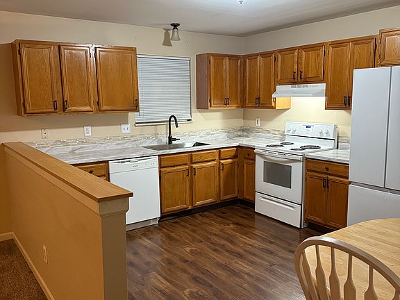 Remodeled Kitchen with Marble Countertops and New Backsplash.
