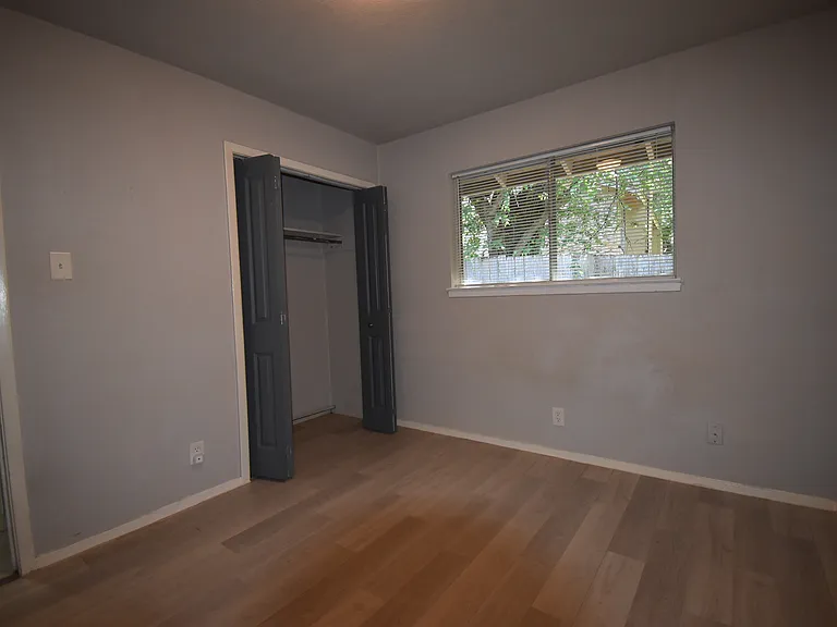 Guest bedroom with view to the private patio