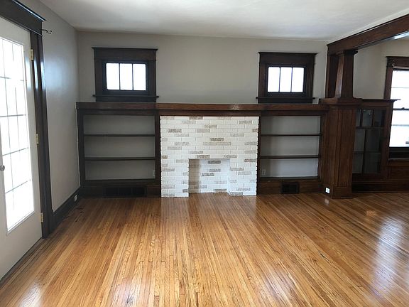 Living room and fireplace with built-in cabinets