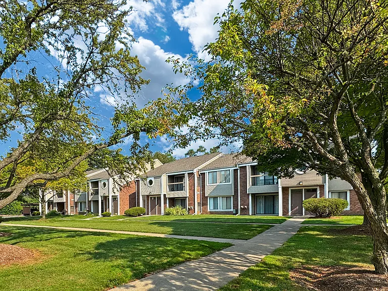 Private-Entry apartment buildings in Southfield with a walkway and sidewalk.