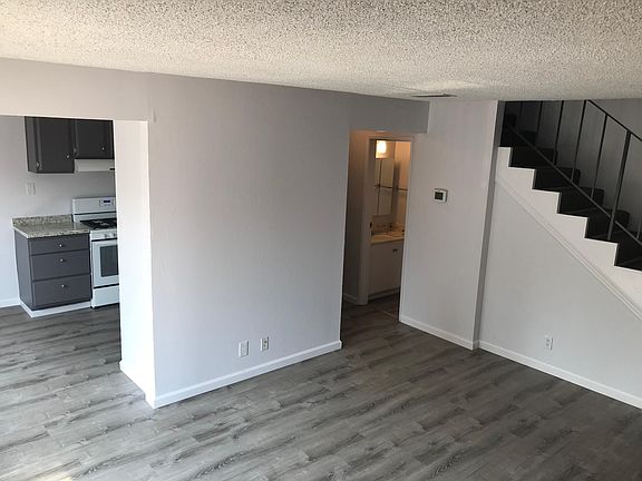 Living room. Entrance to the unit and 1/2 bath are in the ri