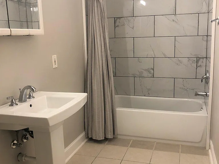 Full renovated Bathroom newer bathtub & new tiled shower walls