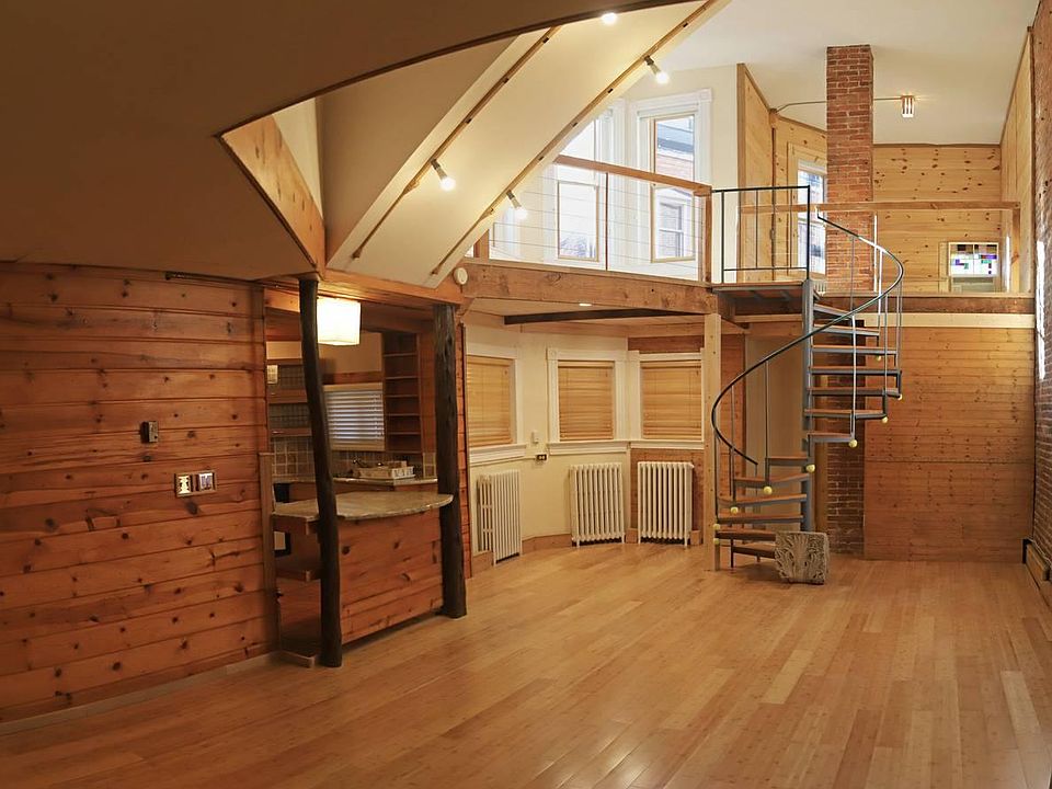 Shows 2 stories of apartment, spiral stairs.