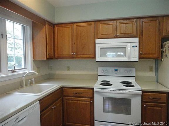 New oak cabinetry.  Corian ...