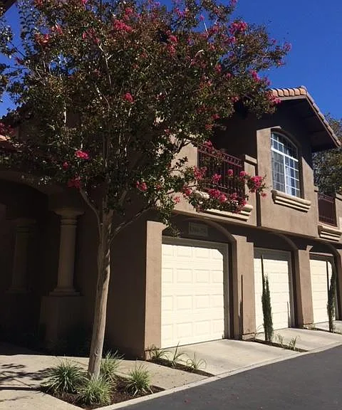 First garage belongs to condo and parking space is in front.