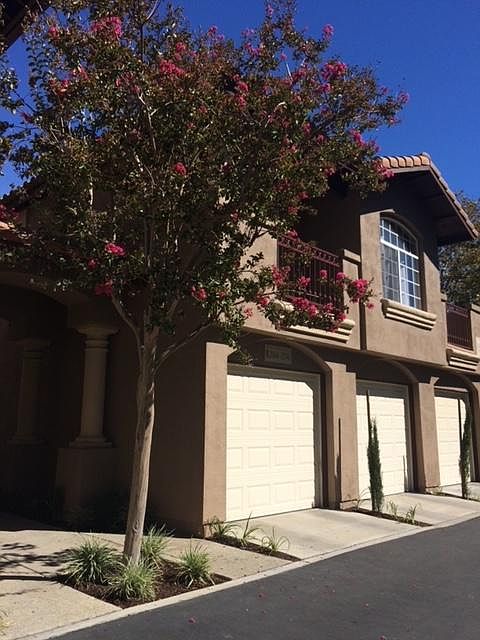 First garage belongs to condo and parking space is in front.