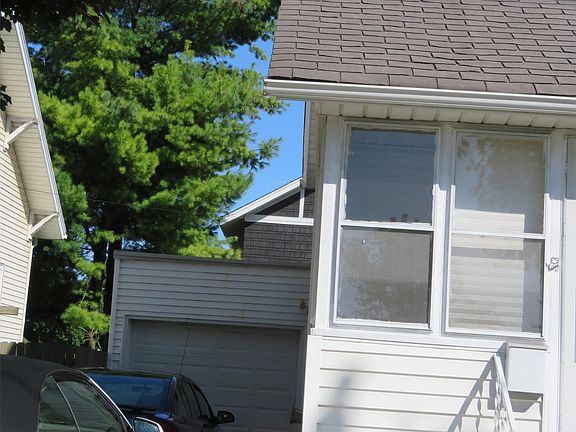 garage with cars in driveway