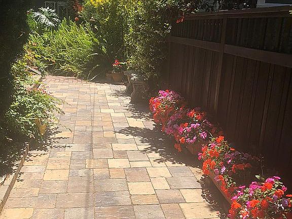 Entrance flanked by impatiens.