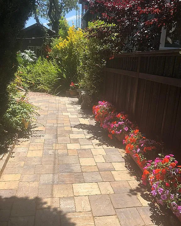 Entrance flanked by impatiens.