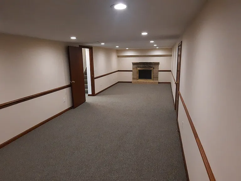 Large finished basement with LED lights . Large enough for a sectional and a pool table or ping pong table