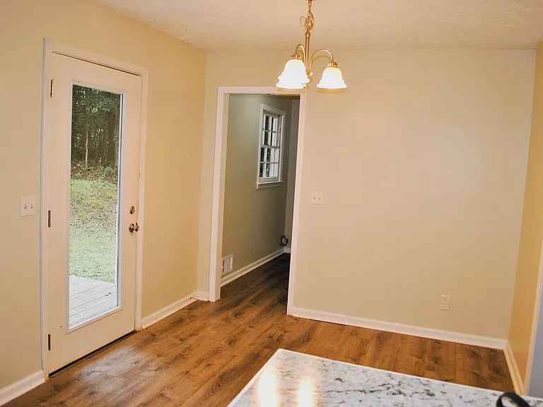 Dining Area Convenient to Carport, Laundry area & Rear Deck