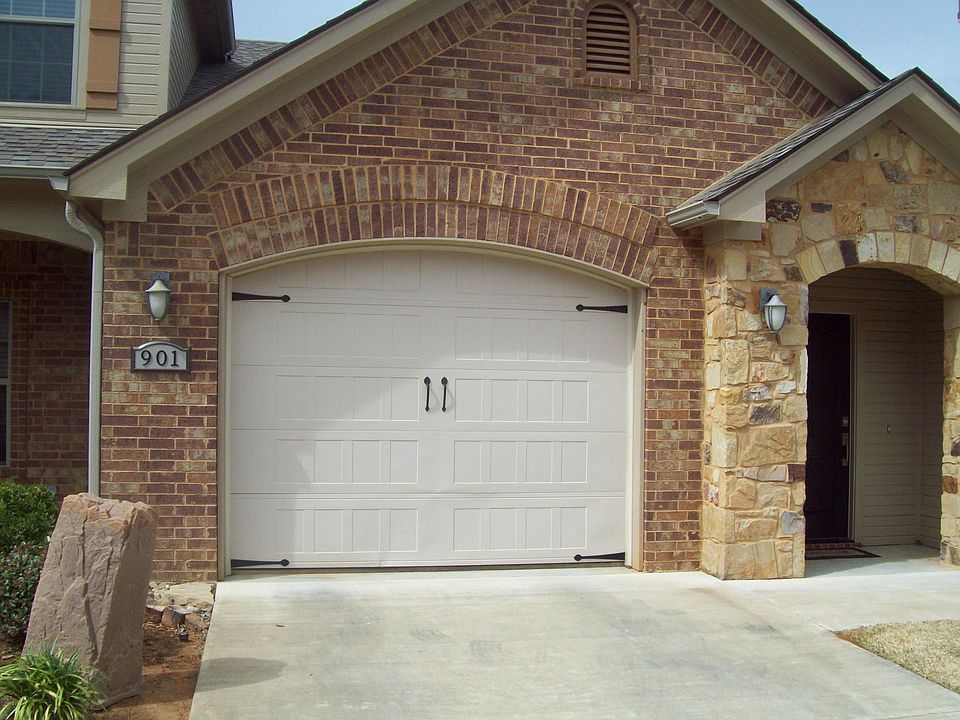 outside view of unit's garage and front door