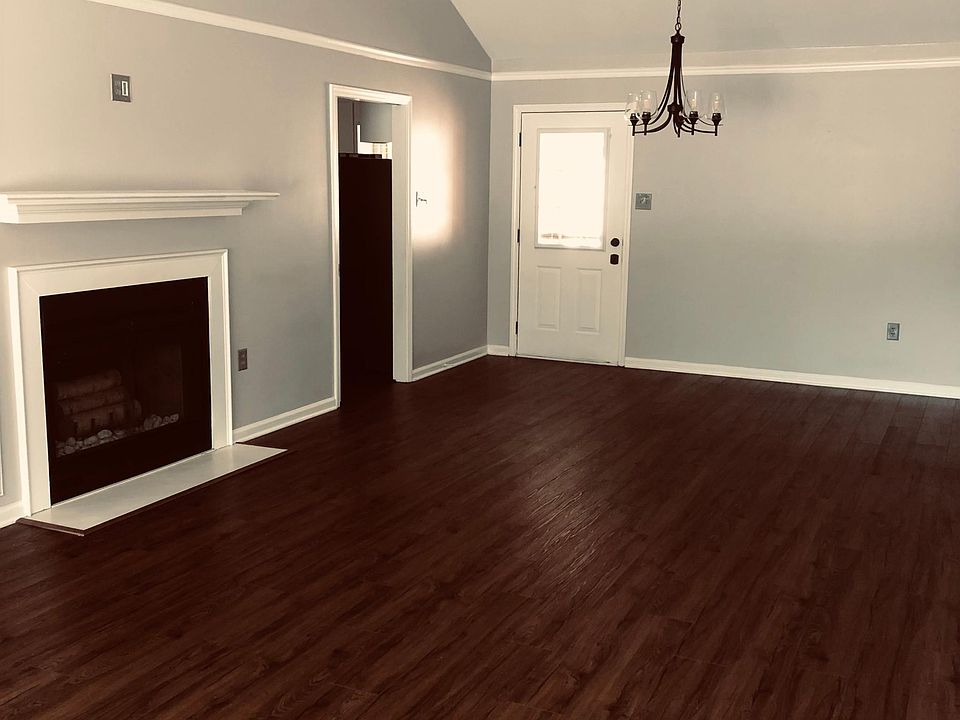Great room with fireplace, door to backyard