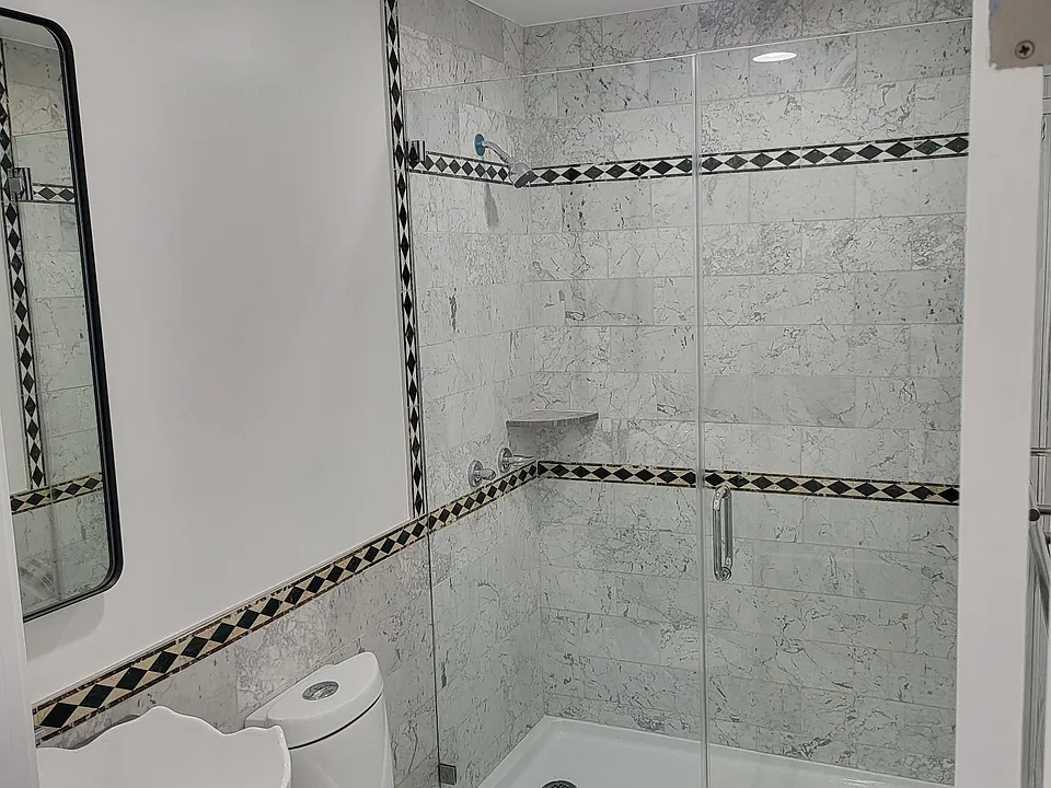 Downstairs hallway guest bathroom fully remodeled.