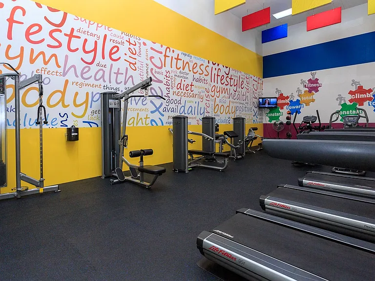 Large fitness center with cardio and strength training equipment