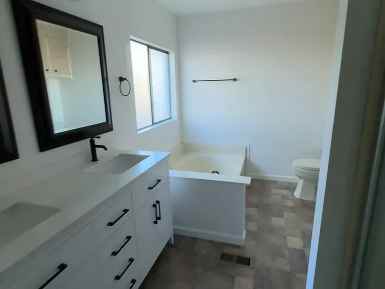 Master bathroom has soaker tub and walk-in shower.