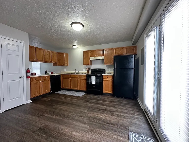 (3-Bedroom 1.5 Bath Unit) Kitchen / Dining room - Freshly painted, new plank flooring,