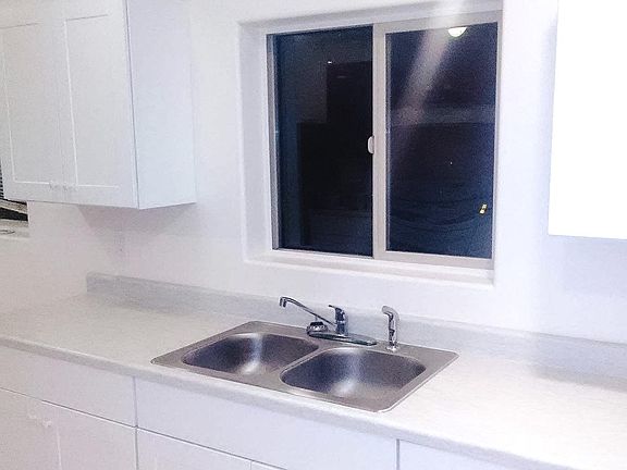 Brand new cabinets, sink, hardware, and counter tops.