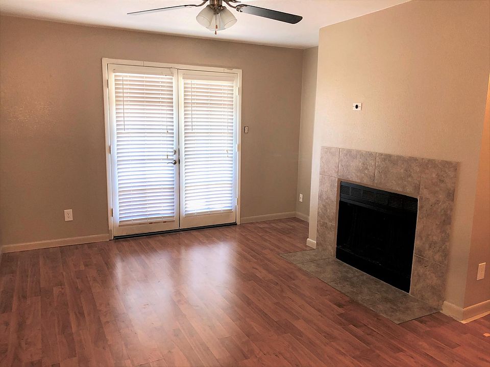 Living Room, with fireplace and balcony entrance.