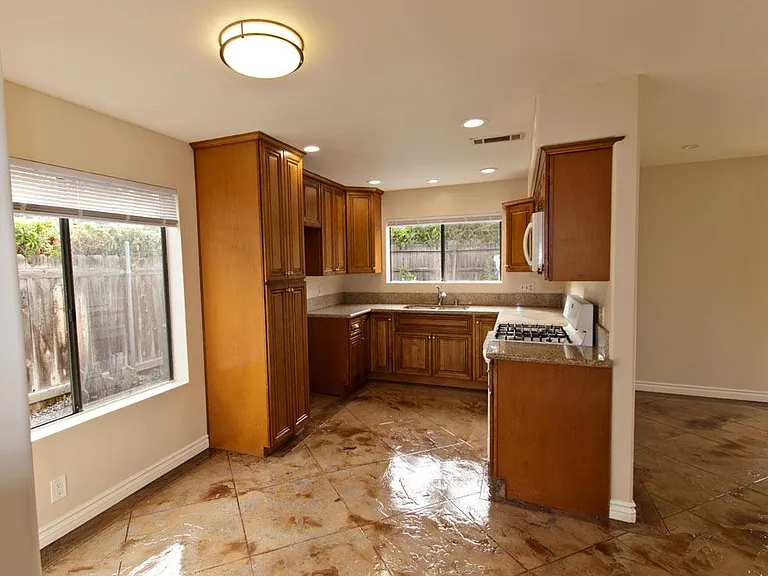 Kitchen backs upto the living room.