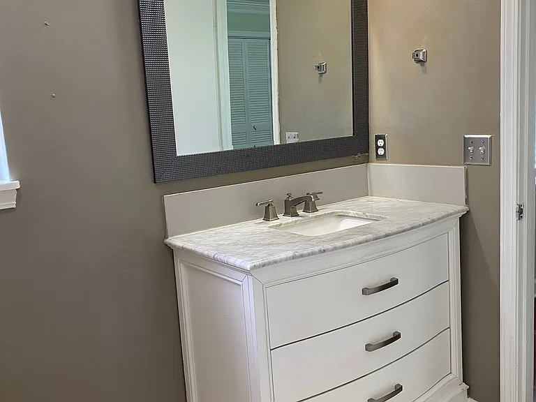 Private primary bathroom with a clean and functional design