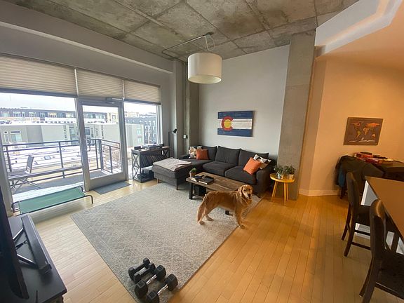 Spacious living room with access to large balcony