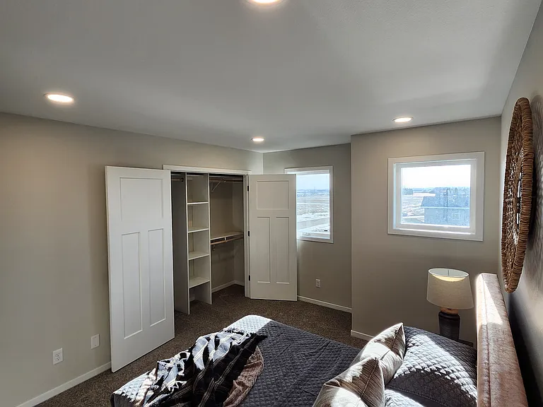 Bedroom three. (Pictures are of another unit with similar finishes and features.)