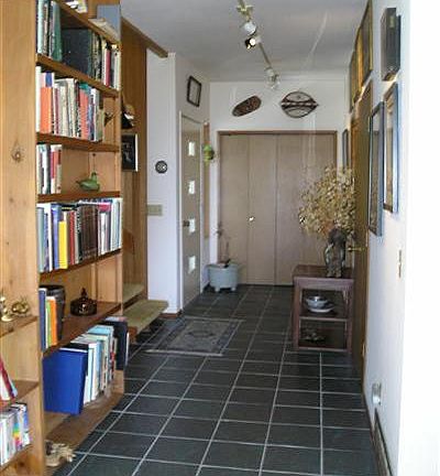 Tile entry has half bath and lead to Open Concept Living