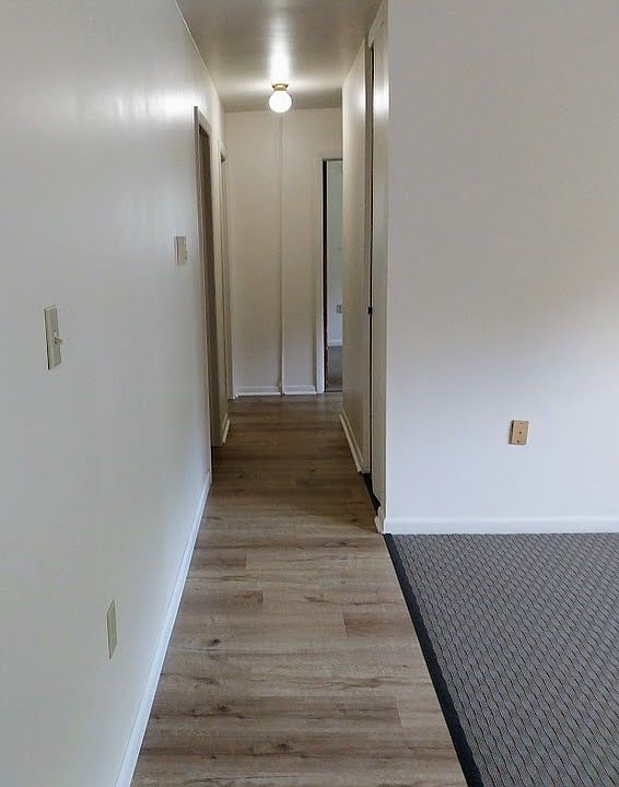 Hallway back to the three bedrooms.