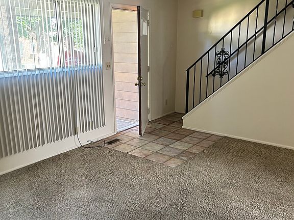 large living room with stairs going upstairs to bedrooms