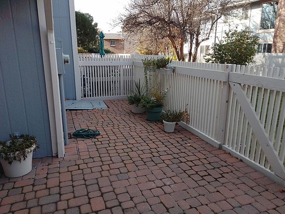 Cobble stone patio easy to keep located in rear of unit.