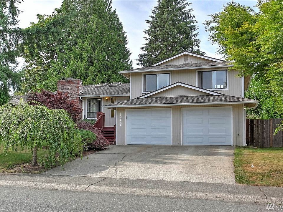 Welcome home to Fairwood Greens and this 3 bedroom, 3 bath home,  located  on a quiet, dead-end street in this well-established neighborhood. The large living room is light and bright with multiple skylights and a welcoming wood burning fireplace. More skylights illuminate the adjoining dining room with plenty of space for large gatherings.  The eat-in kitchen features a showy skywall window and a glass front cabinet.  Extend your living and entertaining space from the kitchen to the deck and the fully-fenced back yard. The deck is surrounded by a mature clematis that will greet you with it's gorgeous, pink, fragrant blooms in late spring. The bountiful back yard incorporates butterfly bushes, roses and an Asian pear tree.