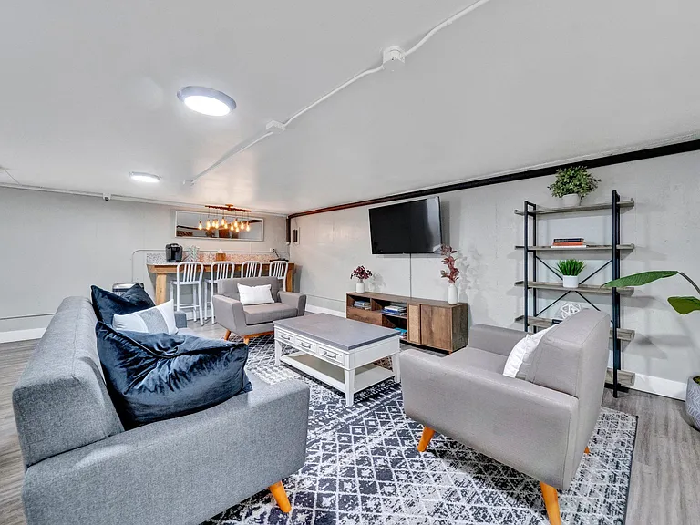 a living room with couches and a coffee table Sunset Station Apartments Portland Oregon