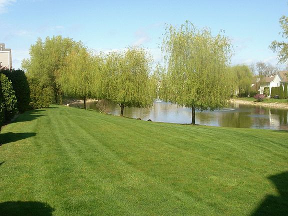 The patio offers wide open grassy areas, as well as a pond front location!