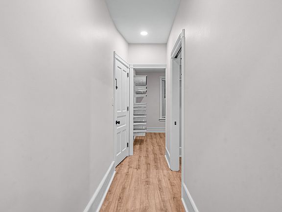 Hallway down to bedrooms view from front door