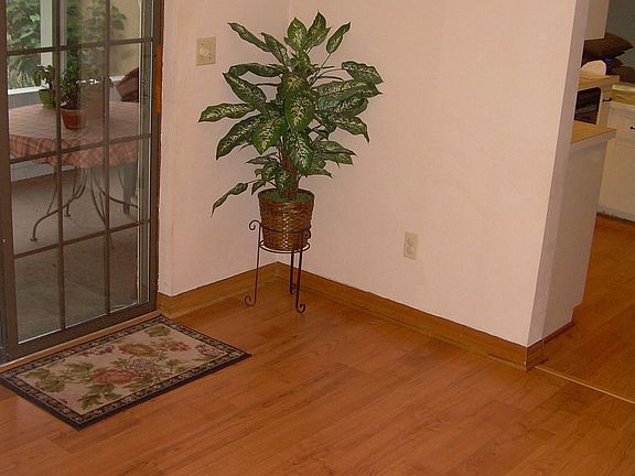 Kitchen eating area with new wood plank flooring