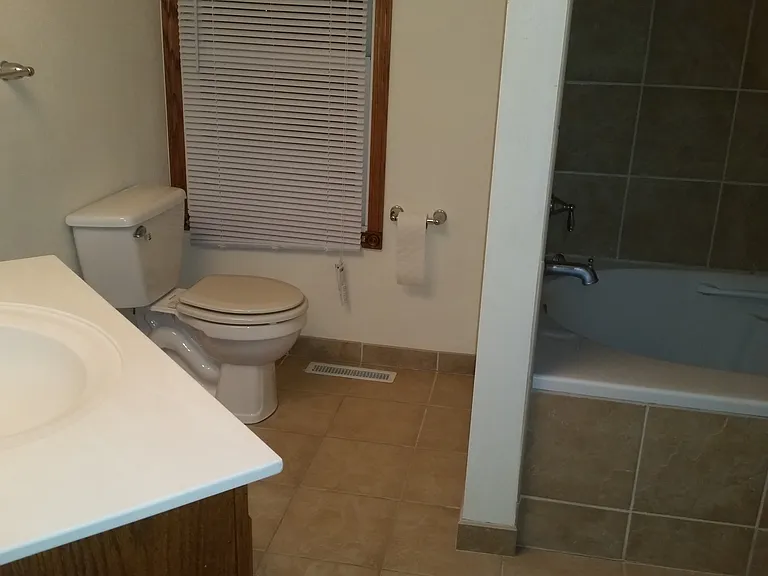 2nd level bathroom with large soaking tub , shower and closet
