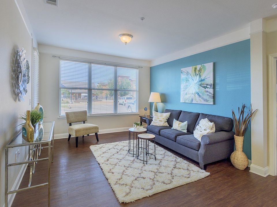 Bright and Airy Living Room with Hardwood Style Flooring