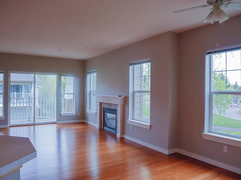 Living room with lots of windows to maximize natural light and views of Casara Park.