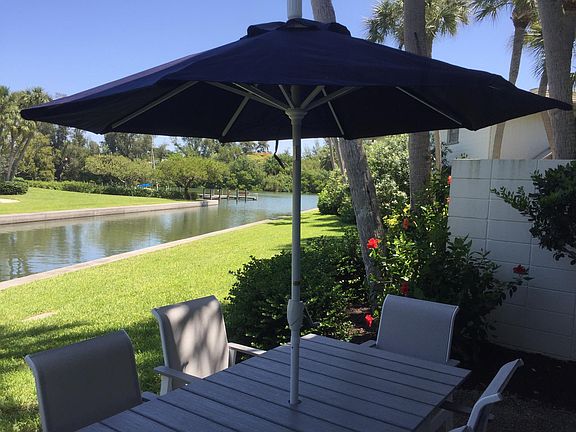 Six seat dining set on rear patio.