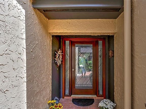 Lovely custom beveled glass door welcomes you