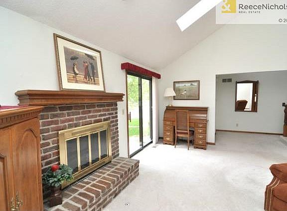 Sun-filled living room walks out to patio